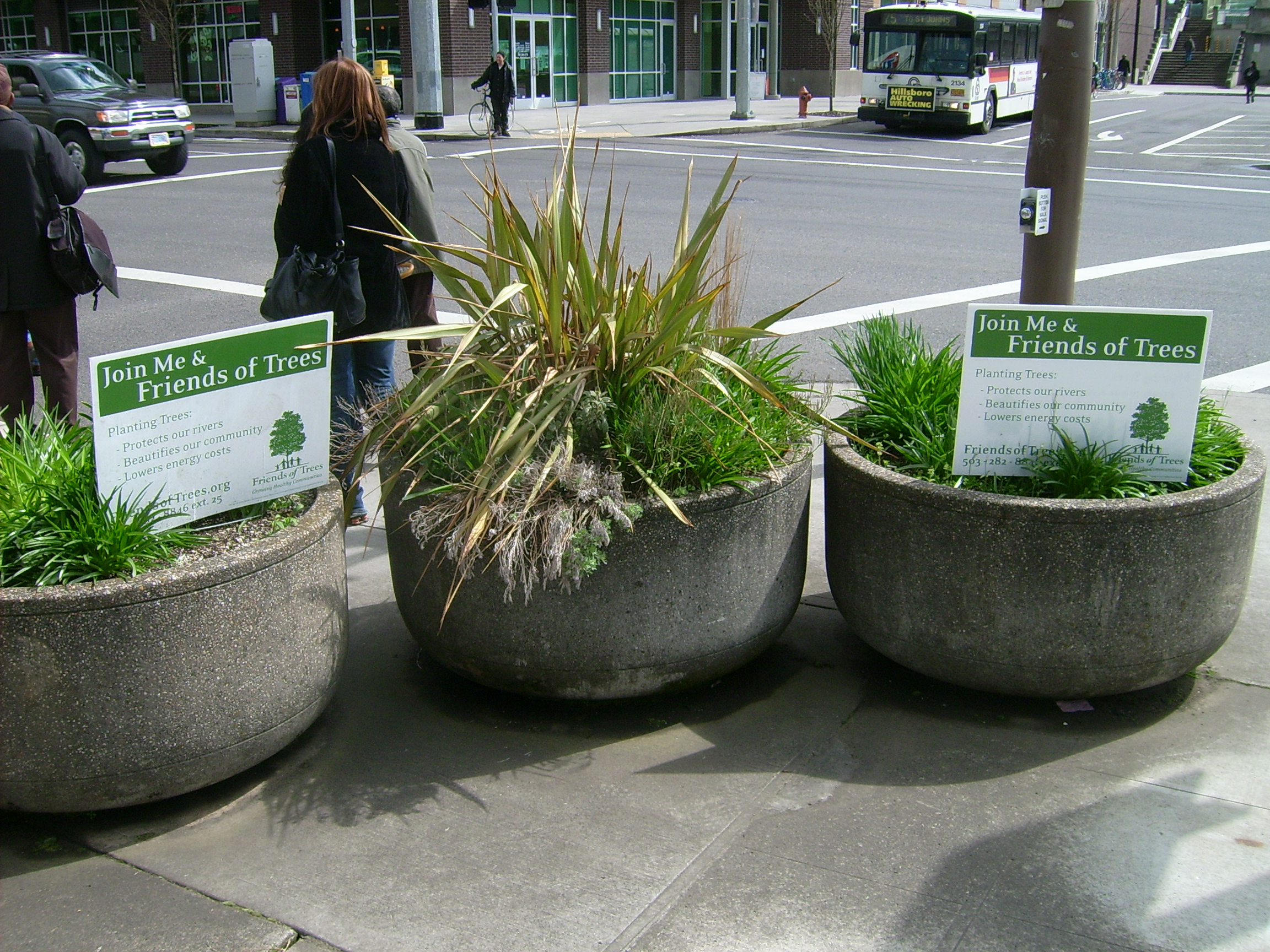 Signs promoting an environmental project in the streets of Portland, OR.